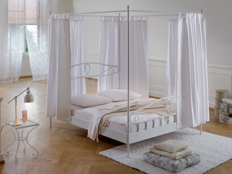 nice-white-wrought-iron-bed-frames-with-white-clean-bed-sheet-and-white-curtain-also-unique-table-lamp-plus-natural-wooden-floor-for-style-beige-bedroom-design-ideas-antique-wrought-iro.jpeg