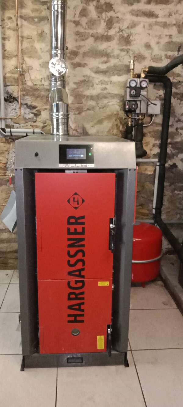 Remplacement d'une chaudière fioul par une chaudière à bûches HARGASSNER 23KW