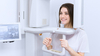 Patiente dans un appareil d'imagerie 3D Cone Beam, cabinet Balma Sourire