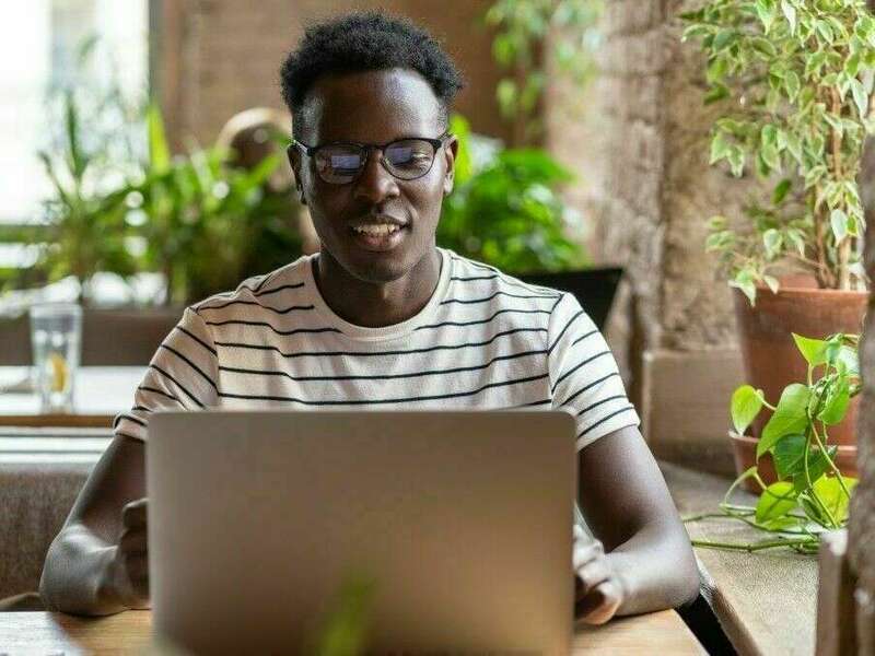 millennial-black-man-student-in-stripped-t-shirt-wear-glasses-watching-educational-webinar-on-laptop_t20_7yk1nb-compressed