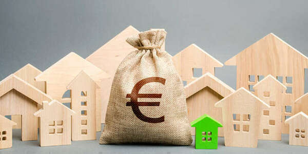 Détermination du prix de revient d’un terrain à bâtir acquis concomitamment avec un ensemble bâti.