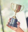a cup is held by one hand