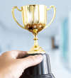 A cup held by a hand