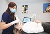Empreinte optique au scanner intra-oral, modèle 3D affiché à l'écran