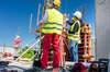 People discussing the construction contract baseline at a construction site