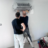 artisan installant pompe à chaleur maison normande
