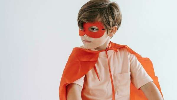 boy dressed up as superhero
