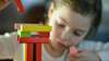 young girl with building blocks