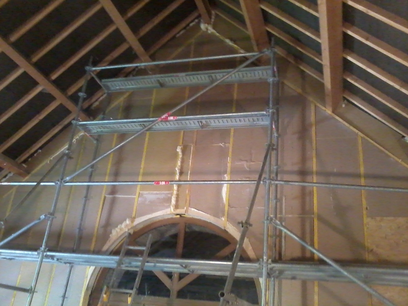 Structure en ossature bois et polyuréthane pour isolation d'un pignon.